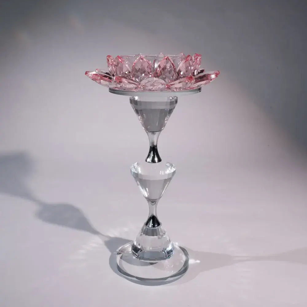 Pink and clear crystal lotus candle holder with faceted geometric design for elegant dining room decor
