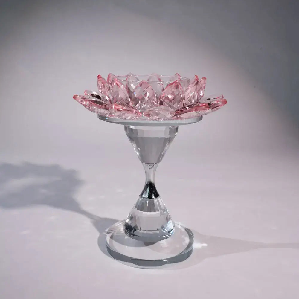 Delicate pink and clear crystal lotus candle holder with glass stem and base for elegant dining room decor