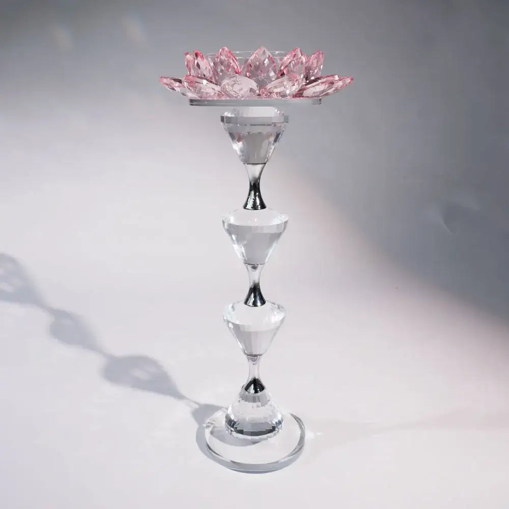 Pink and clear crystal lotus candle holder with delicate pink crystal petals and metallic accents for dining room decor