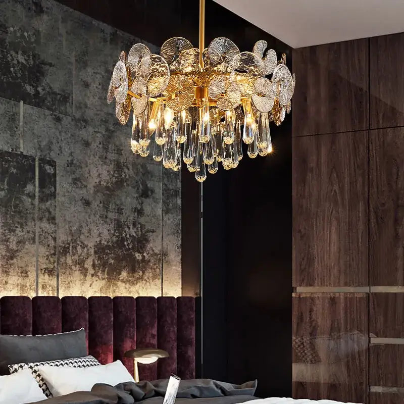 Nordic golden crystal lotus chandelier with intricate translucent glass petals and dangling crystal teardrops for dining room luxury