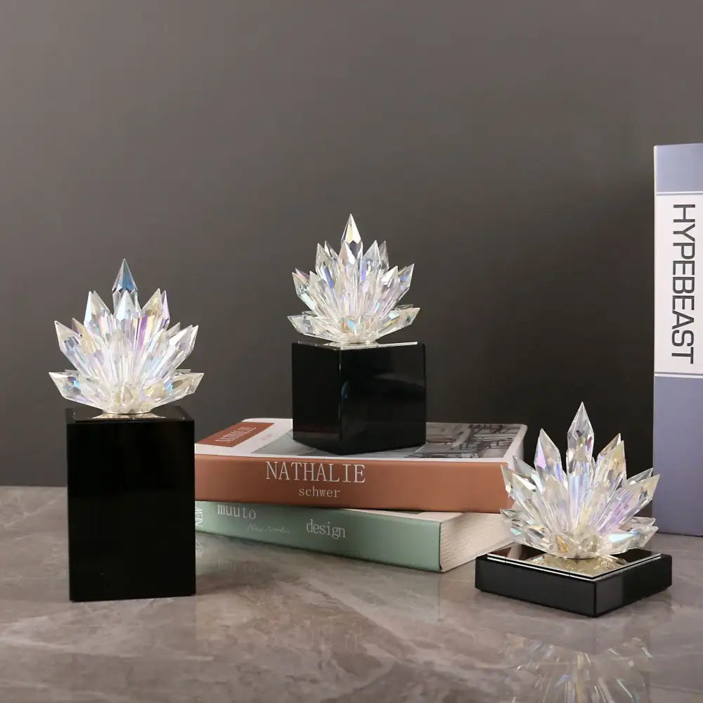 Clear crystal lotus tabletop decoration with faceted radiant petals on sleek black square bases by decorbites crystal lotus