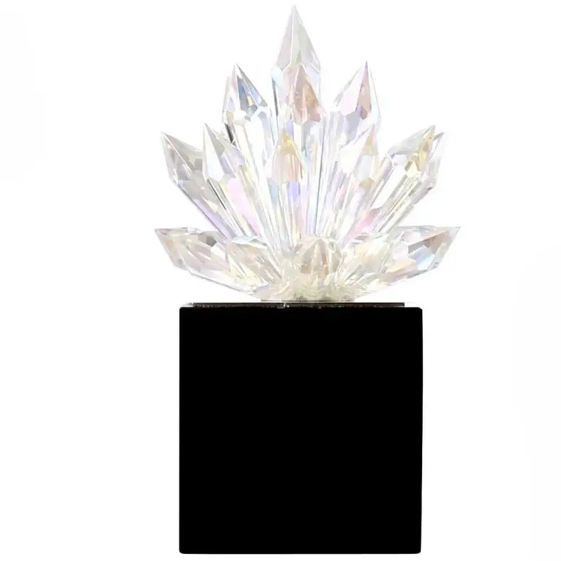 Translucent faceted crystal lotus tabletop decoration with a clear crystal cluster on a sleek black base by decorbites crystal lotus