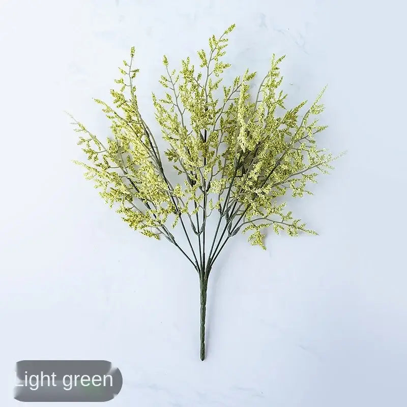 Mint green ceramic vase with light green artificial flower bouquet and delicate lemon grass branch for living room decor