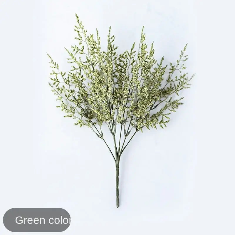 Mint green ceramic vase featuring a delicate lover lemon grass branch with feathery foliage for living room decor