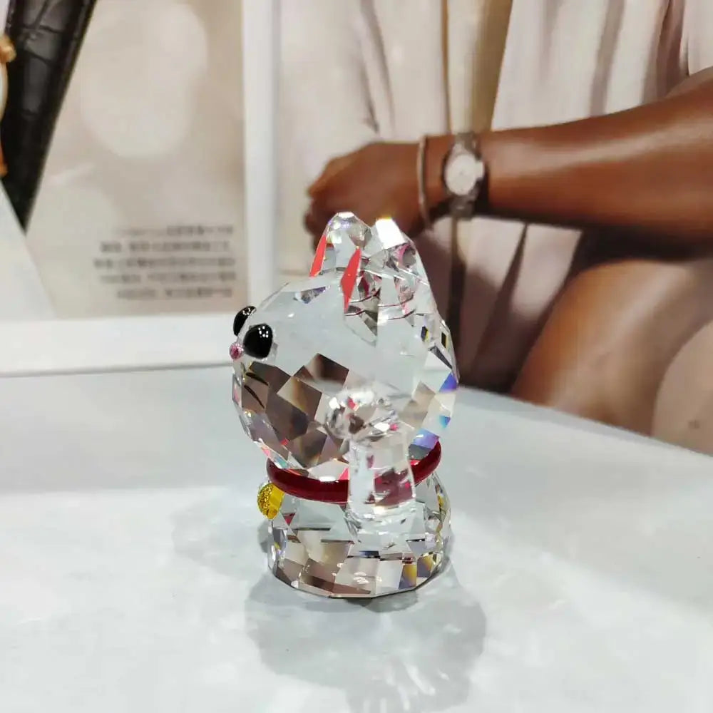 Faceted crystal lucky cat figurine with black eyes and red collar perfect for living room decor