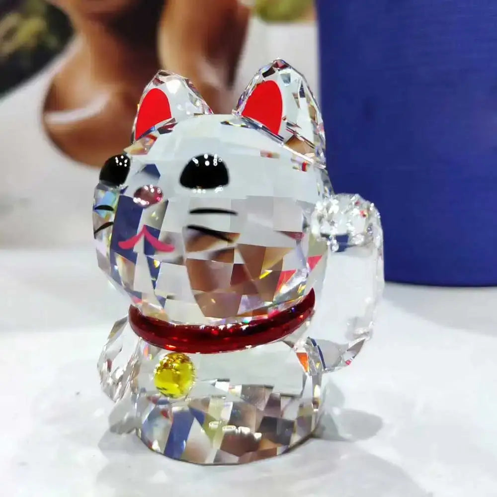 Faceted crystal lucky cat figurine with red inner ears black eyes and red collar with yellow gemstone for living room decor