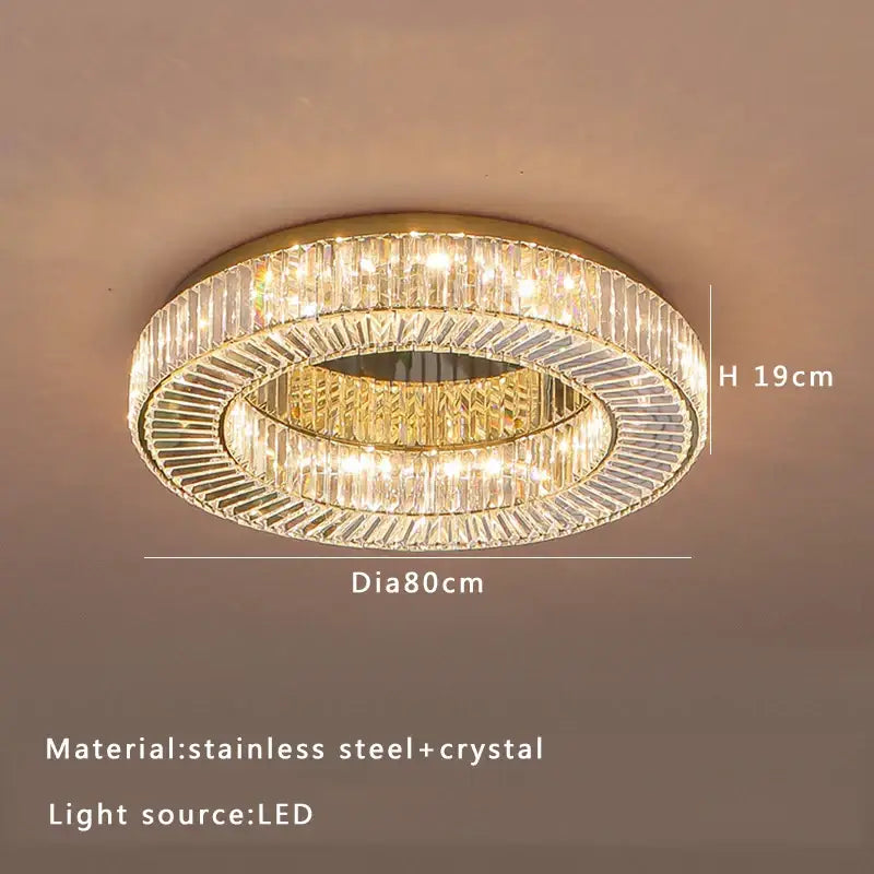 A modern gold led ceiling lamp with stainless steel frame and crystal luxe accents for dining room decorbites lighting