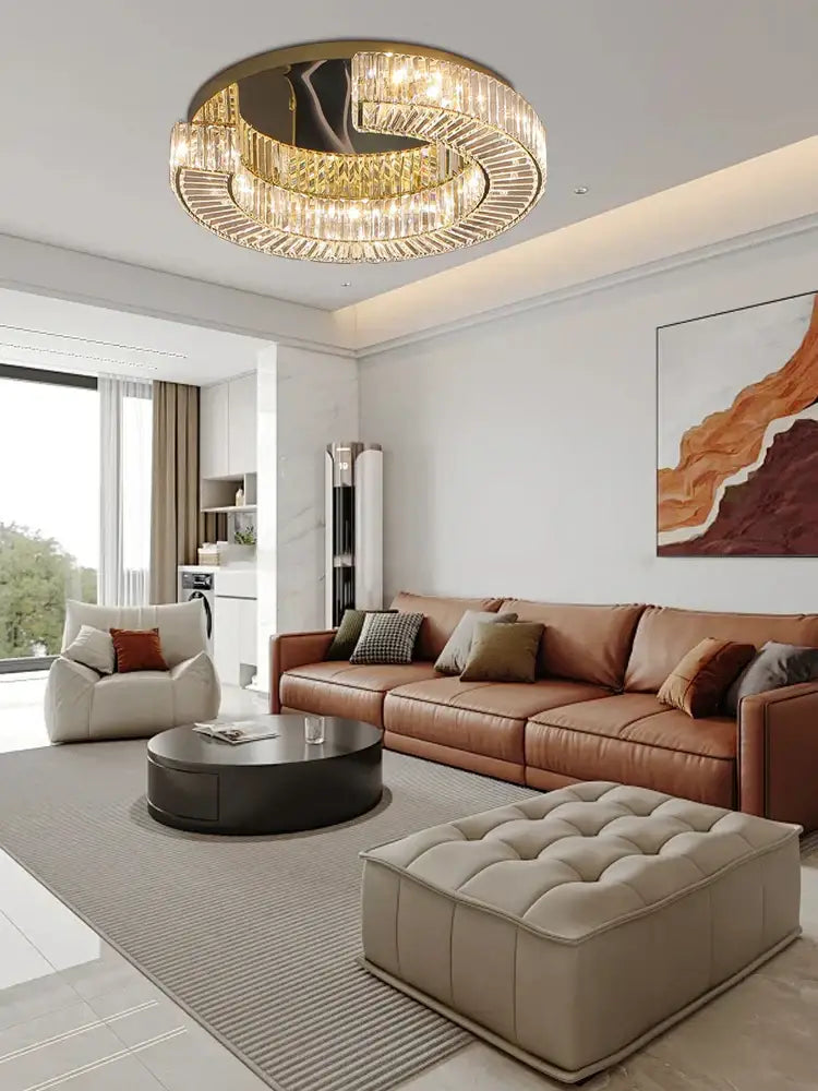 Modern gold led ceiling lamp with multiple tiers of clear crystal prisms in a decorbites crystal luxe frame