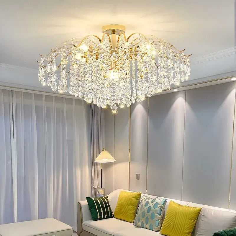 A luxurious crystal luxe led gold chandelier with cascading clear glass droplets for living room decor
