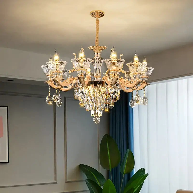 European gold crystal luxe pendant lamp with intricate crystal droplets and ornate arms for dining room use