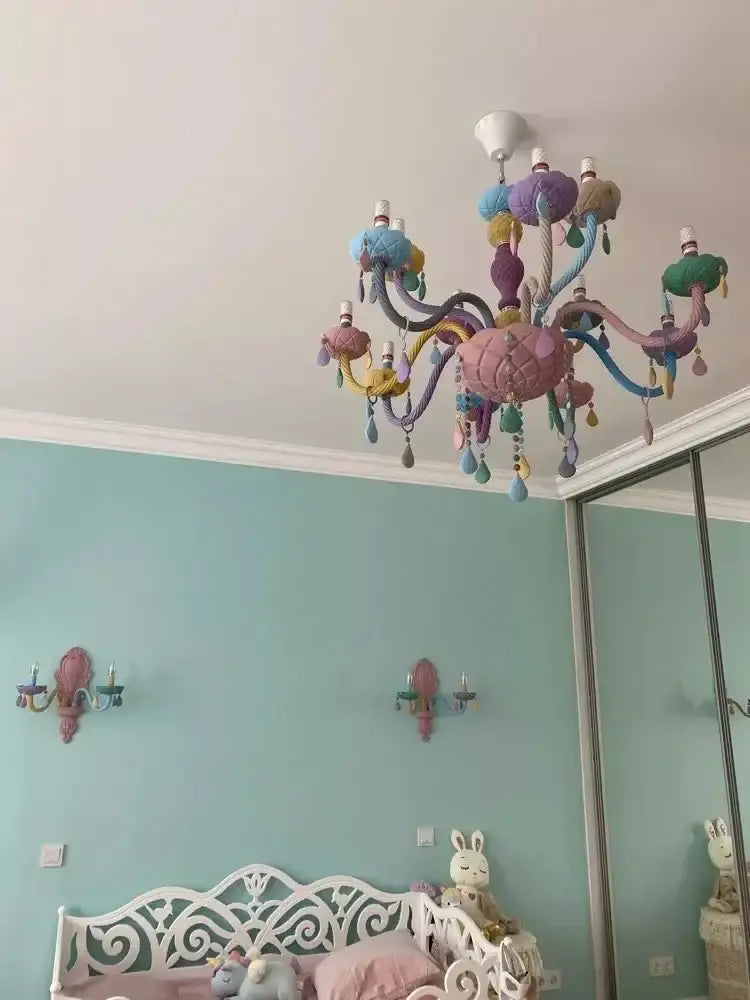 Pastel rainbow crystal luxury candle chandelier featuring quilted pink body and colorful textured arms for decorbites crystal luxury decor