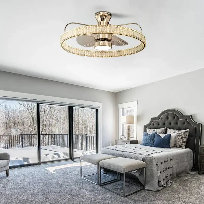 Luxury gold ceiling fan with crystal-encrusted ring and integrated light fixture for elegant living room ambiance