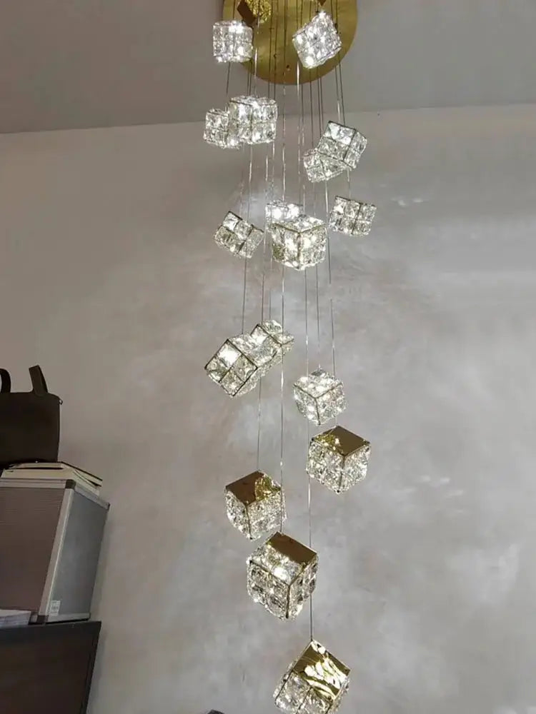 A decorbites crystal modern cubic chandelier with gold-toned metal and clear faceted glass for living room lighting