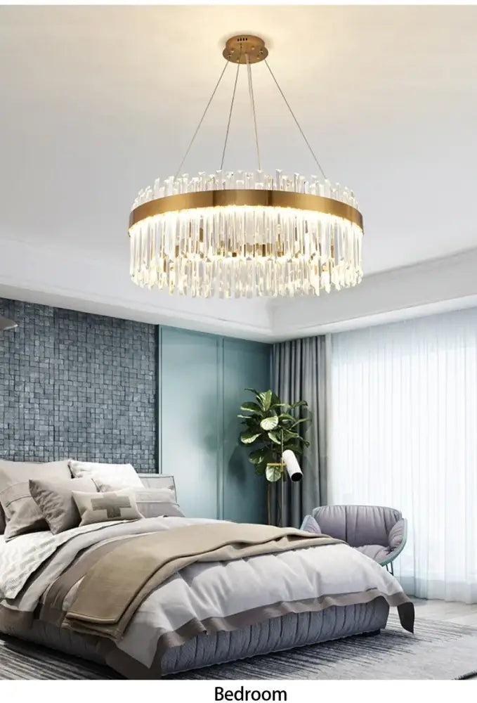 Gold-toned decorbites™ crystal pendant chandelier with cascading clear crystal rods for luxury modest crystal home decor