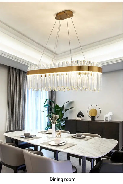 Gold-toned decorbites™ crystal pendant chandelier with cascading clear crystal prisms for luxury modest crystal home decor