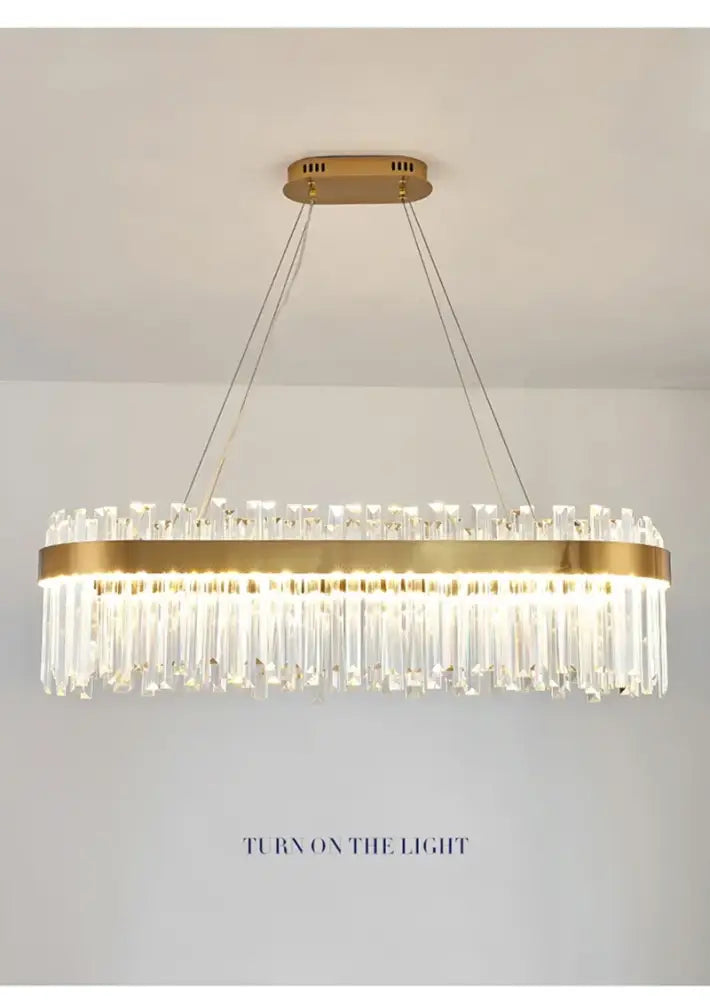 Gold-toned DecorBites™ crystal pendant chandelier with cascading clear prisms for luxury modest crystal home decor