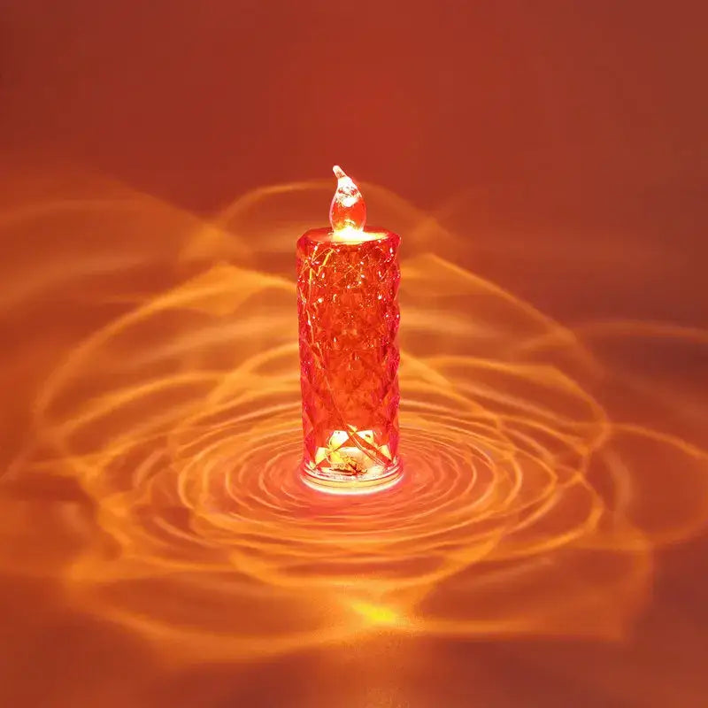 A decorbites crystal rose red led candle night light with a textured translucent body and glowing flame tip