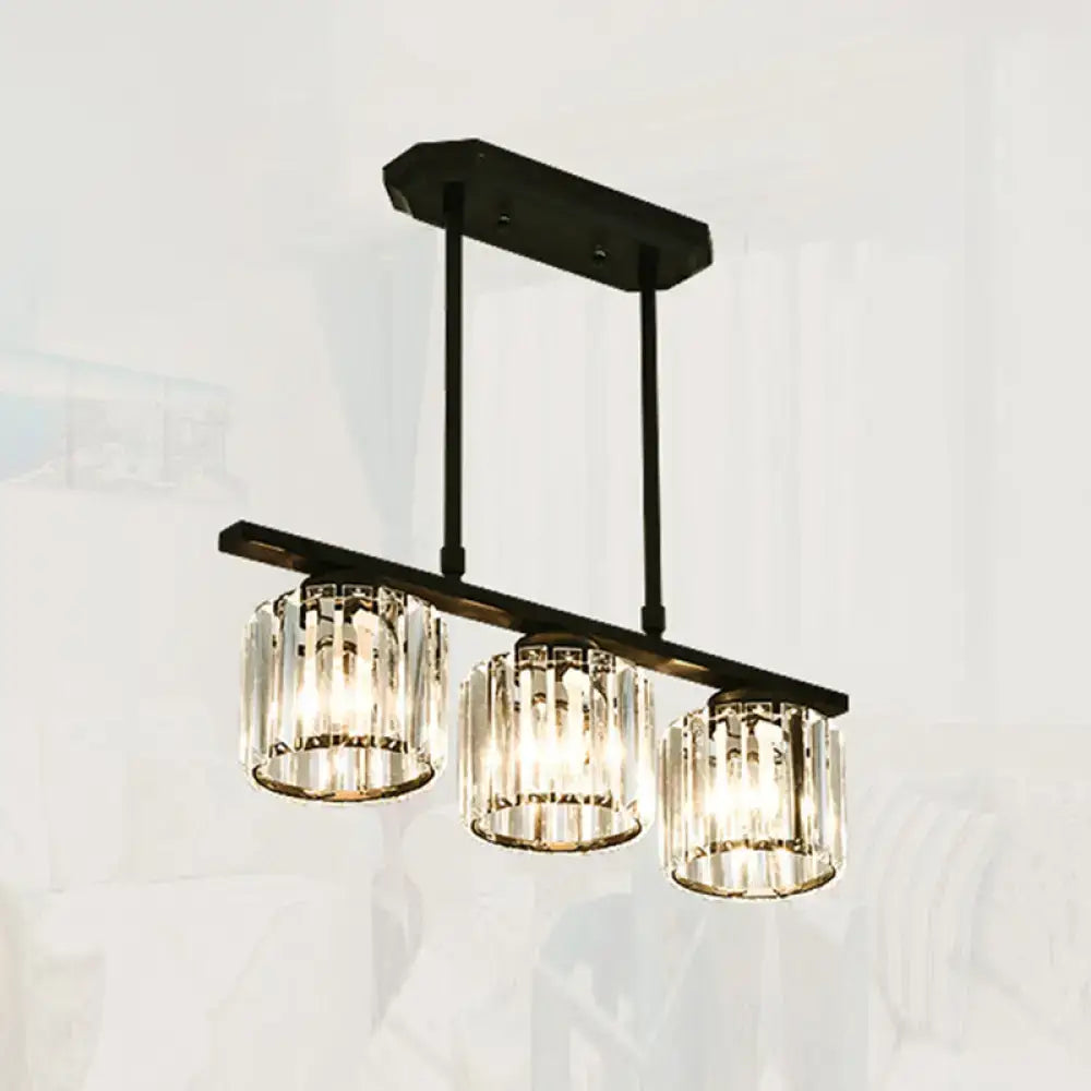 Black metal chandelier with three cylindrical crystal shades for dining room island from decorbites™ simple style