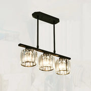 Black metal chandelier with three cylindrical crystal shades for dining room island from decorbites™ simple style