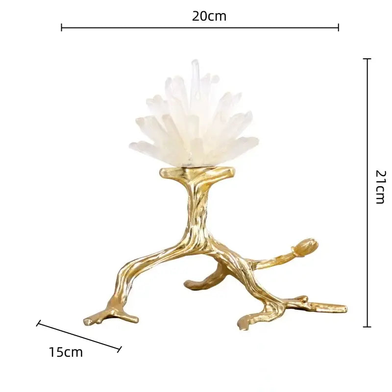 A white quartz crystal stone golden cluster on a detailed golden bird branch stand by decorbites for living room decor