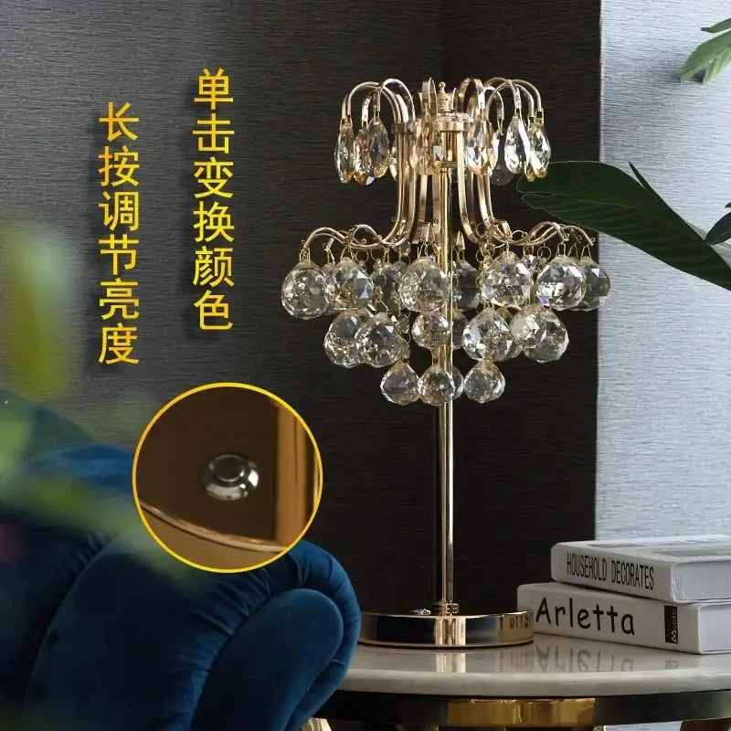 Gold-toned decorbites crystal table lamp with chandelier style and dangling faceted clear crystals for bedroom lighting