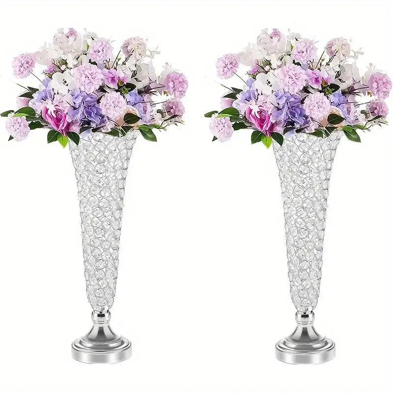 Two tall crystal vases with silver bases and pink purple white artificial flowers for dining tables home decor