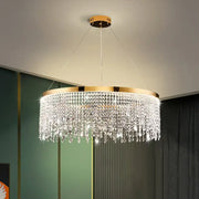 Decorbites crystal waterfall chandelier with gold-toned metal frame and clear crystal droplets for dining room lighting