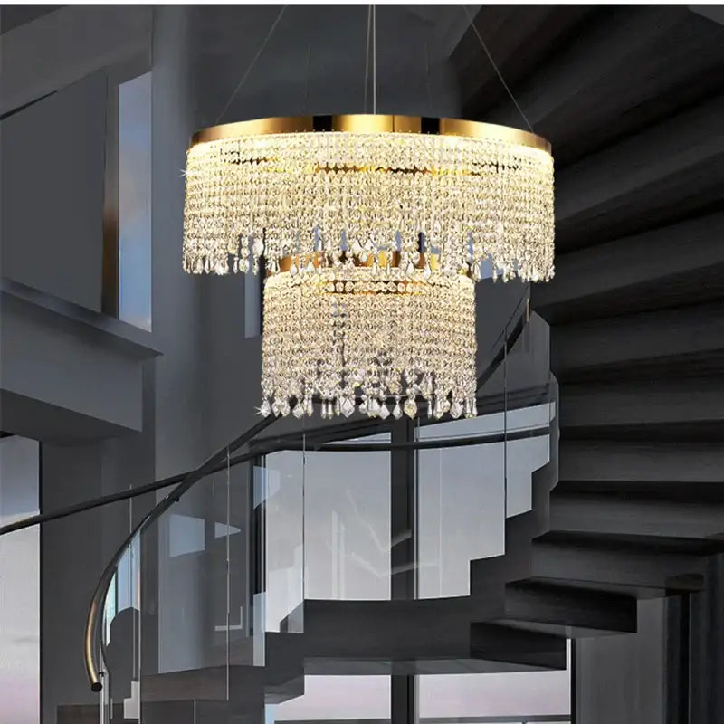Gold-toned decorbites crystal waterfall chandelier with cascading crystal tiers and teardrop crystals for dining room light