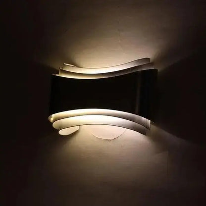 DecorBites™ curved modern wall sconce in black and white with sleek layered design and integrated LED lighting