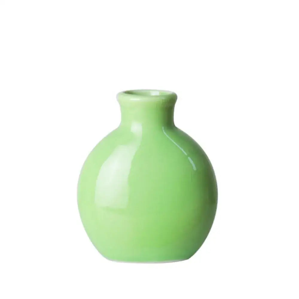 DecorBites™ cute mini ceramic flower vase pot featuring a smooth glossy light green ceramic flower vase
