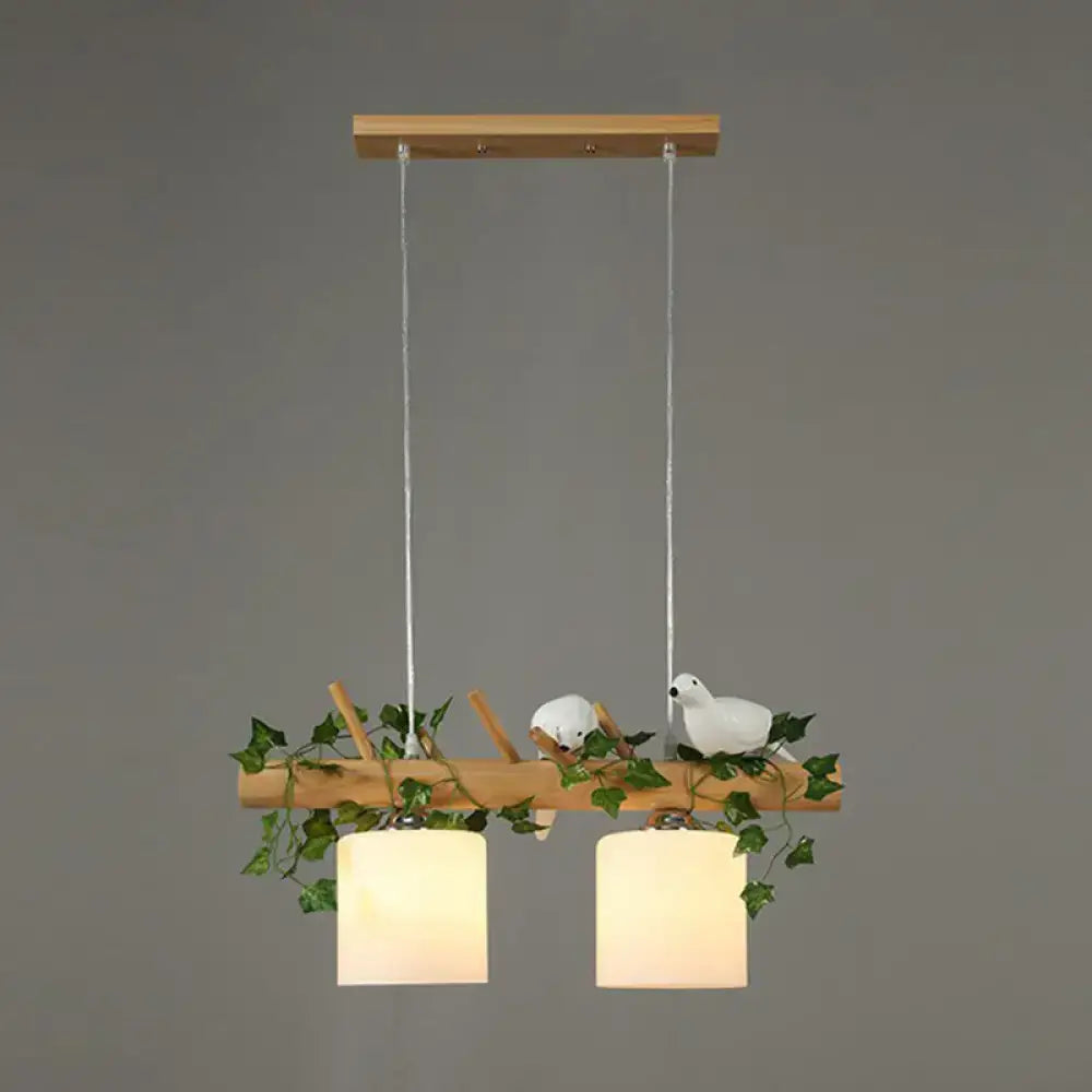 Decorbites™ cylindrical milk glass pendant light with cream shades resin bird deco on rustic wood branch for country style