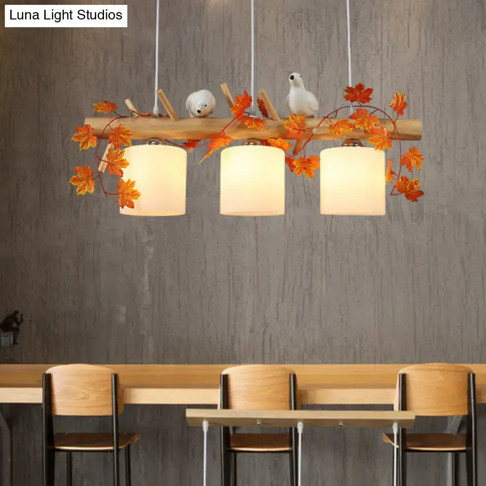 DecorBites cylindrical milk glass pendant light with white lampshades and resin bird deco for country style restaurants