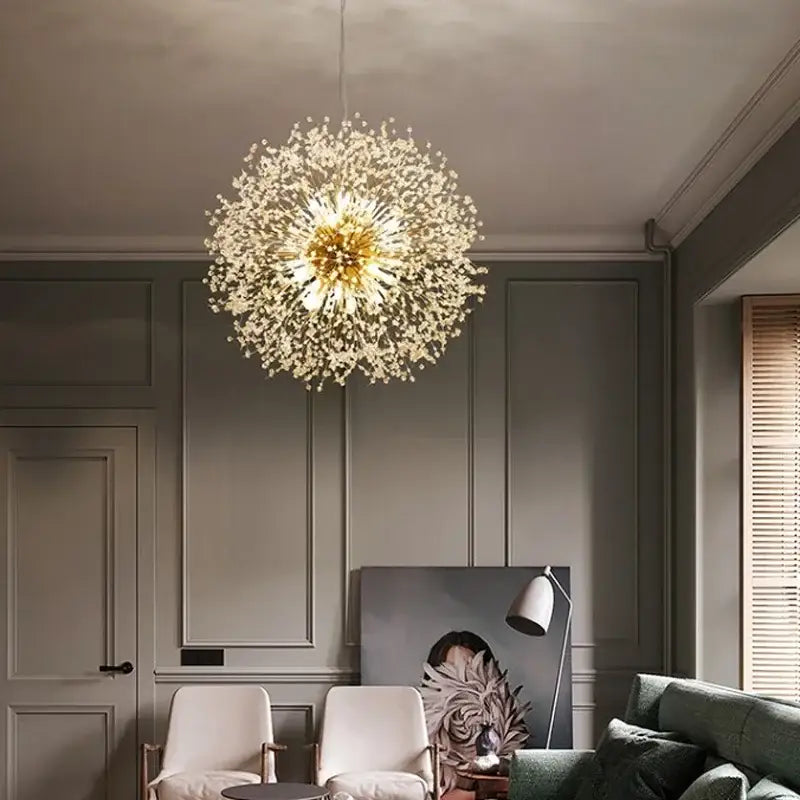 A golden spherical decorbites dandelion chandelier featuring delicate crystal strands for elegant living room lighting
