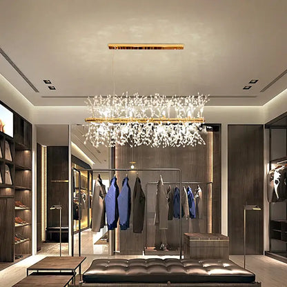 A modern decorbites dandelion chandelier with a gold-toned frame and cascading white crystal branches for living rooms