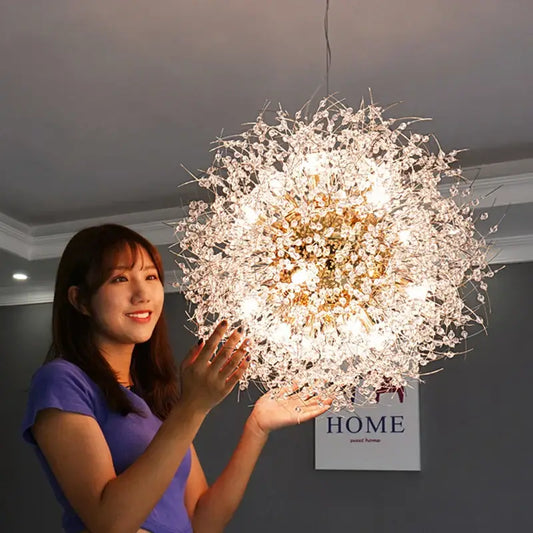 A decorbites dandelion chandelier with clear crystal elements radiating from a golden core for living room lighting