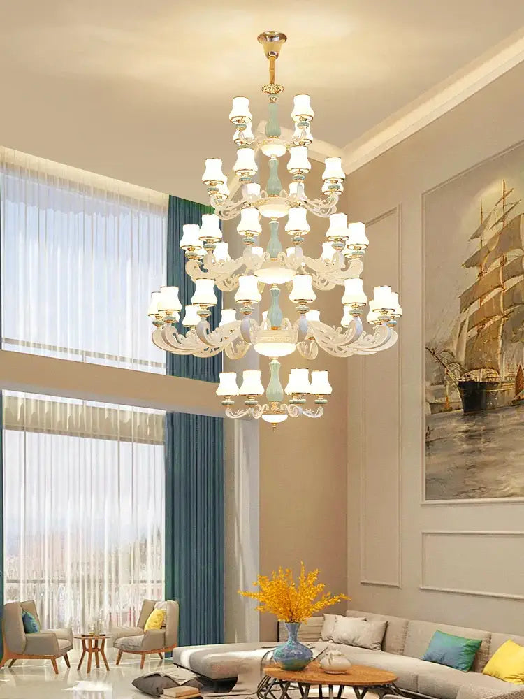 A decorbites deluxe duplex multi-tiered chandelier with clear crystal arms gold-toned center and frosted glass shades
