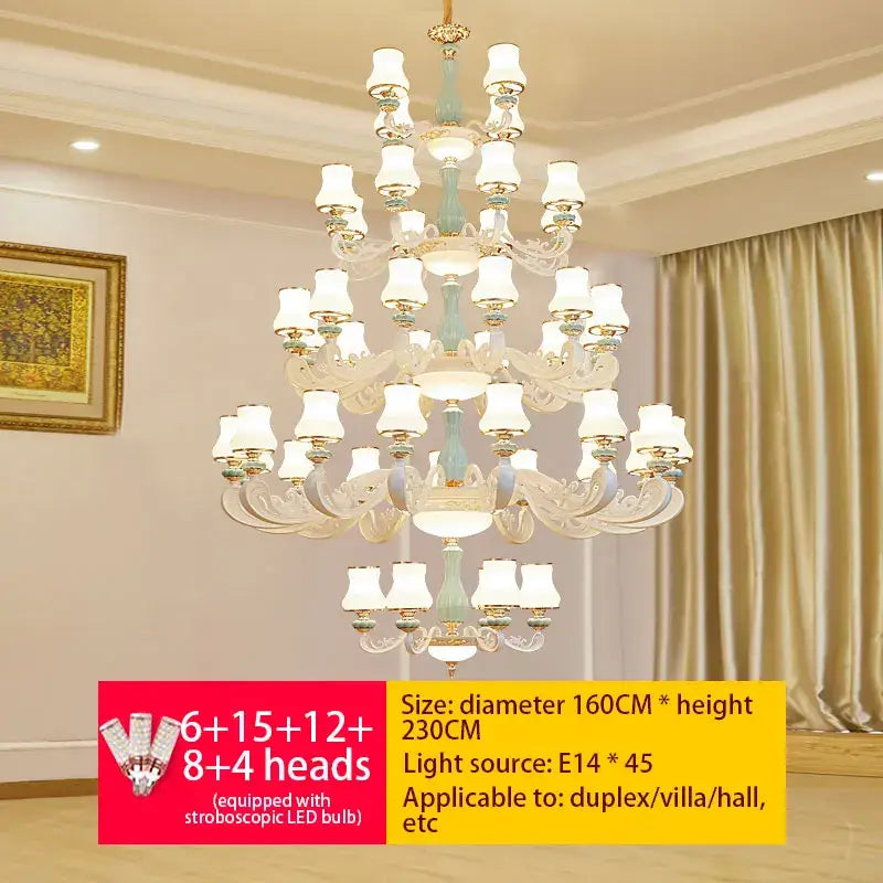 An ornate decorbites deluxe duplex living room chandelier with light blue and gold finish and frosted glass shades