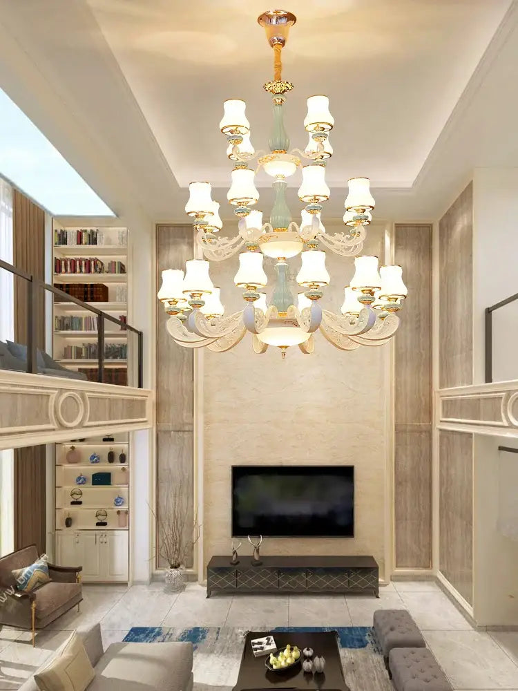 A decorbites deluxe duplex living room chandelier with white lampshades gold accents and teal green glass column