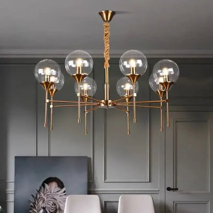 Brass-finished designer metal chandelier with six glass globes and twisted rope pendant for modern living