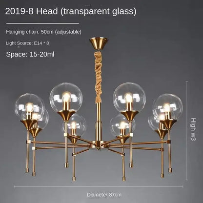Brass-finished decorbites™ designer metal chandelier with eight transparent glass globes and adjustable hanging chain