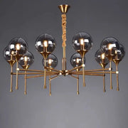 Brass-finished decorbites™ designer metal chandelier with multiple smoky glass globes and twisted rope pendant for modern living