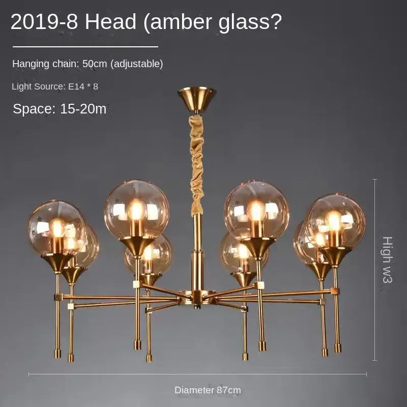 Gold-toned DecorBites designer metal chandelier with eight amber glass globes and twisted brass hanging chain for modern living