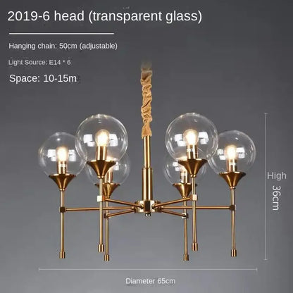 Gold-toned designer metal chandelier with six transparent glass globes and twisted fabric-covered hanging chain for modern living