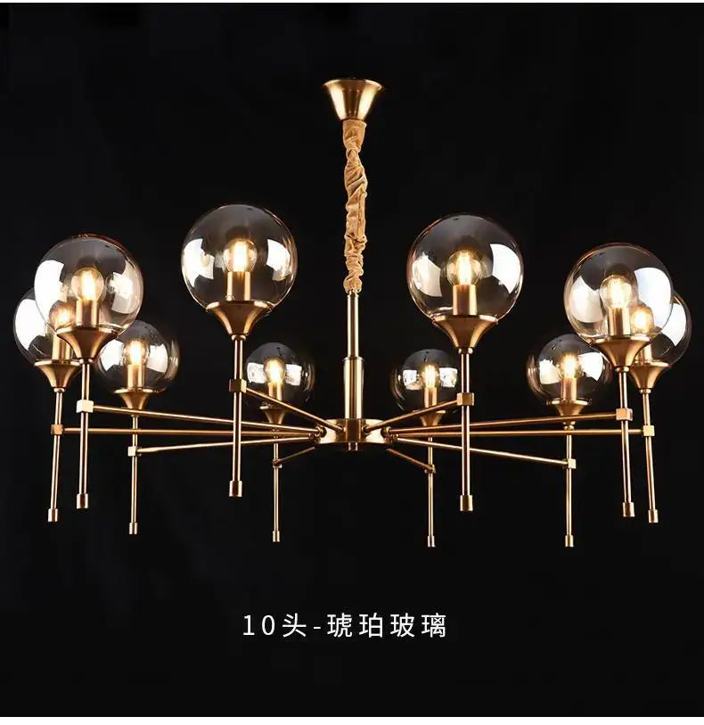 Gold-toned designer metal chandelier with ten spherical glass shades and twisted rope-like central pendant for modern living