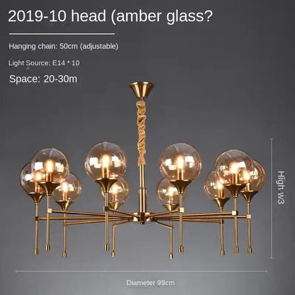 Gold-toned designer metal chandelier with ten amber glass globes and twisted rope hanging chain for modern living