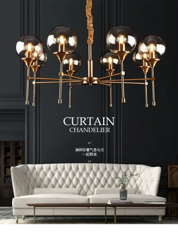 Gold-toned designer metal chandelier with multiple spherical glass globes and twisted rope suspension for modern living
