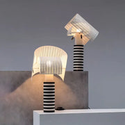 Two decorbites™ designer metal nightstand lamps with black and white striped column and swivel mesh shade with led incandescent fluorescent compatibility