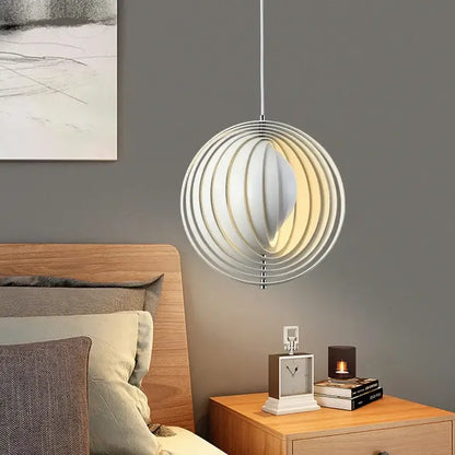 Modern white decorbites designer moon led chandelier with concentric wooden rings and warm glowing interior for dining room