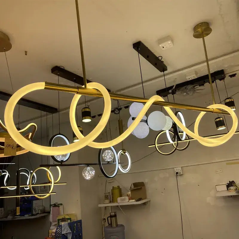 Golden modern decorbites™ dimmable nordic led ceiling chandelier with sleek serpentine design and warm glowing rings for home decor