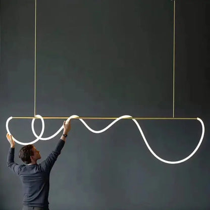 A sleek gold-toned decorbites™ dimmable nordic hose led ceiling chandelier with a glowing white led strip for home decor